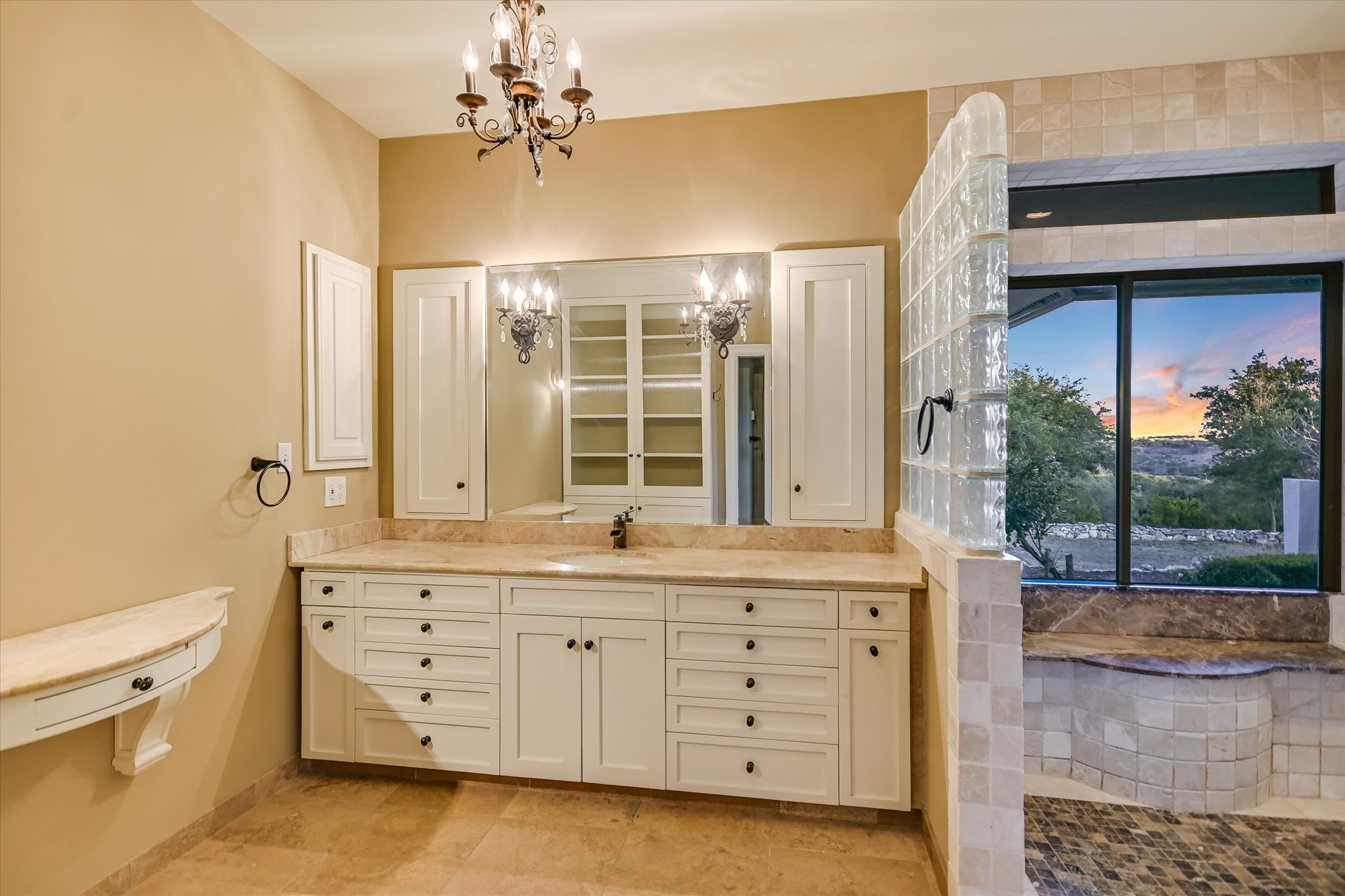 1984 Divide Pass Blanco, TX 78606 - Photo 18 of 36 a spacious bathroom with a double vanity sink a mirror and a shower