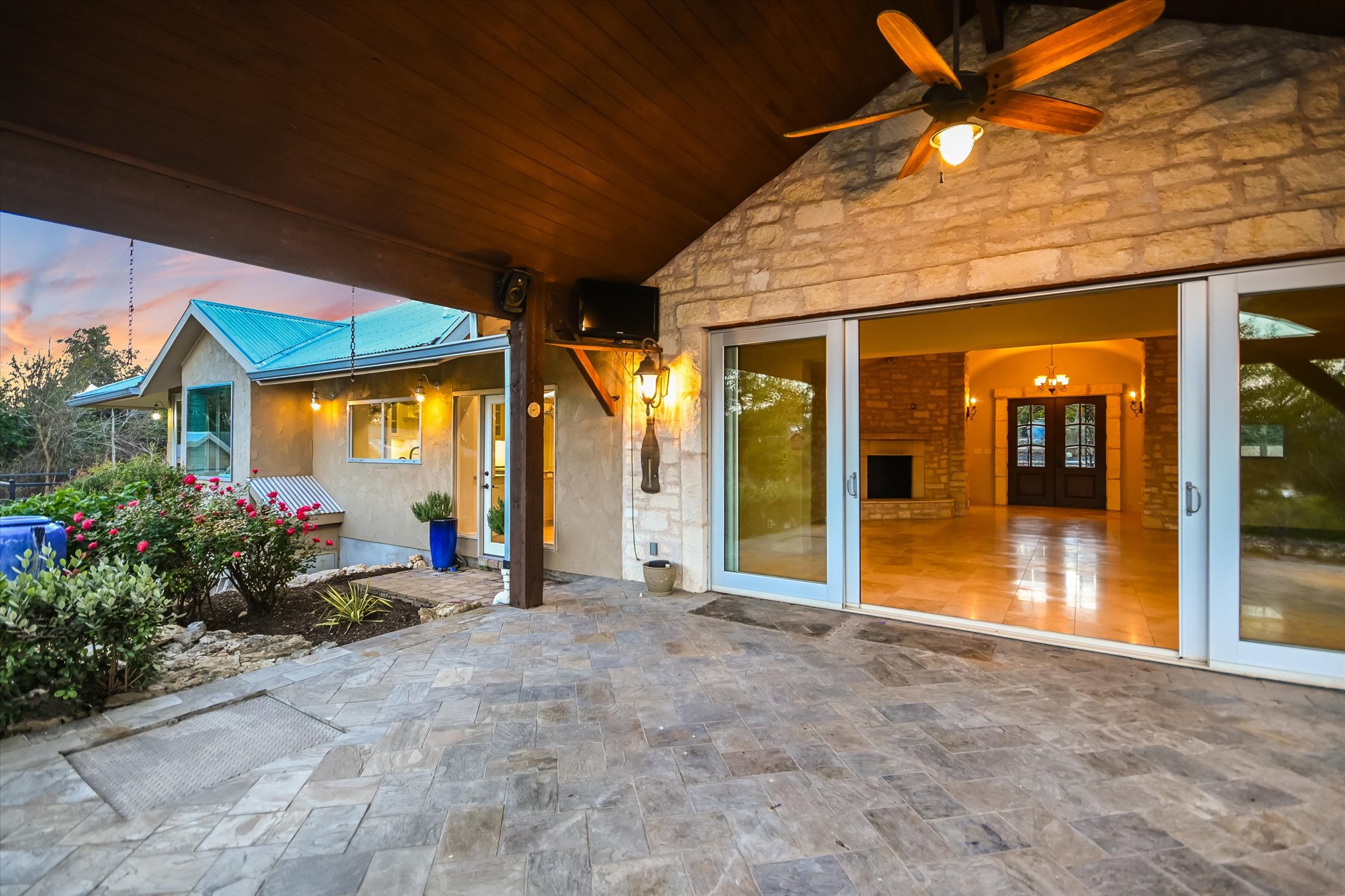 1984 Divide Pass Blanco, TX 78606 - Photo 19 of 31 a view of a porch with a table and chairs under an umbrella