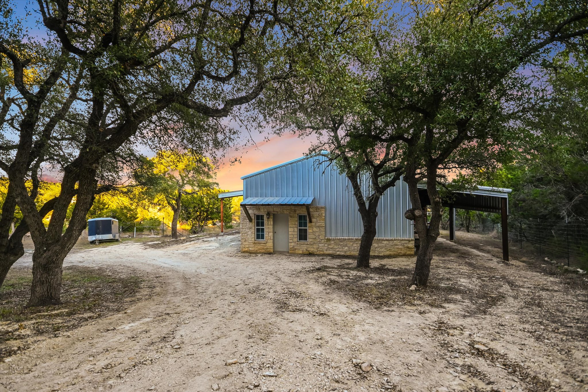 1984 Divide Pass Blanco, TX 78606 - Photo 27 of 31 a house with trees in front of it