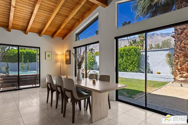 a view of a dining room with furniture window and outside view