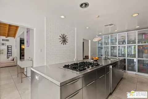 a kitchen with a stove and a refrigerator