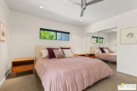 a bedroom with bed and a window