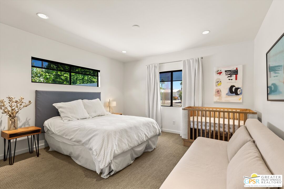 1465 North Rodeo Road Palm Springs, CA 92262 - Photo 22 of 43 a bedroom with a bed and a dresser with rug