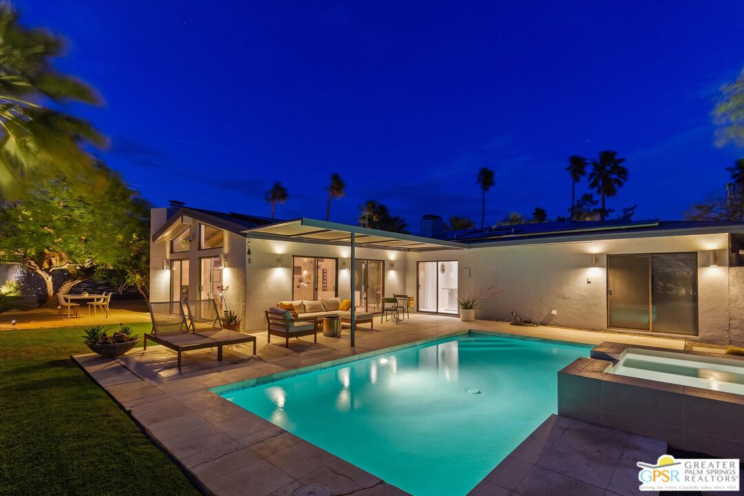 1465 North Rodeo Road Palm Springs, CA 92262 - Photo 38 of 43 a view of a swimming pool with outdoor seating