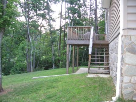 470 Green Level Road Boones Mill, VA 24065 - Photo 2 of 10 a front view of a house with a yard and glass windows