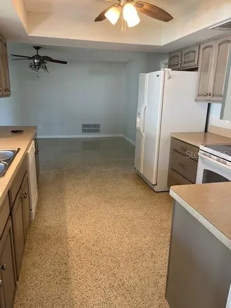 a room with a cabinets and a sink