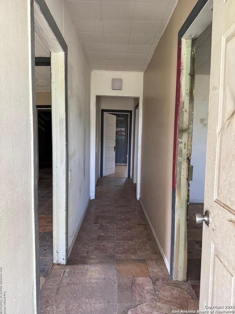 1210 King David Drive Three Rivers, TX 78071 - Photo 6 of 17 a view of a hallway with wooden floor and staircase