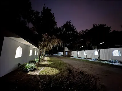 a view of a street both of side of building with green space