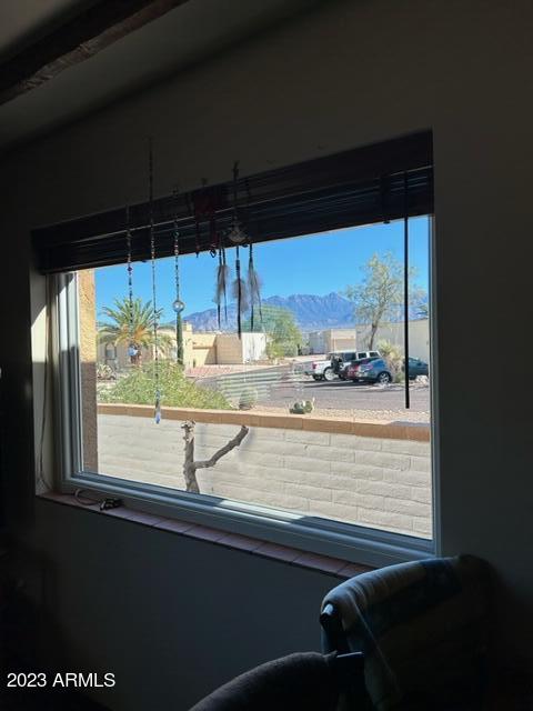 1172 West Mountain View Green Valley, AZ 85622 - Photo 11 of 35 a view of a two chair and a table in the balcony