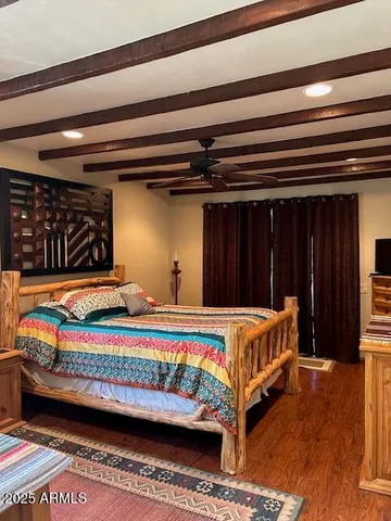 a bed sitting in a bedroom next to a cabinet