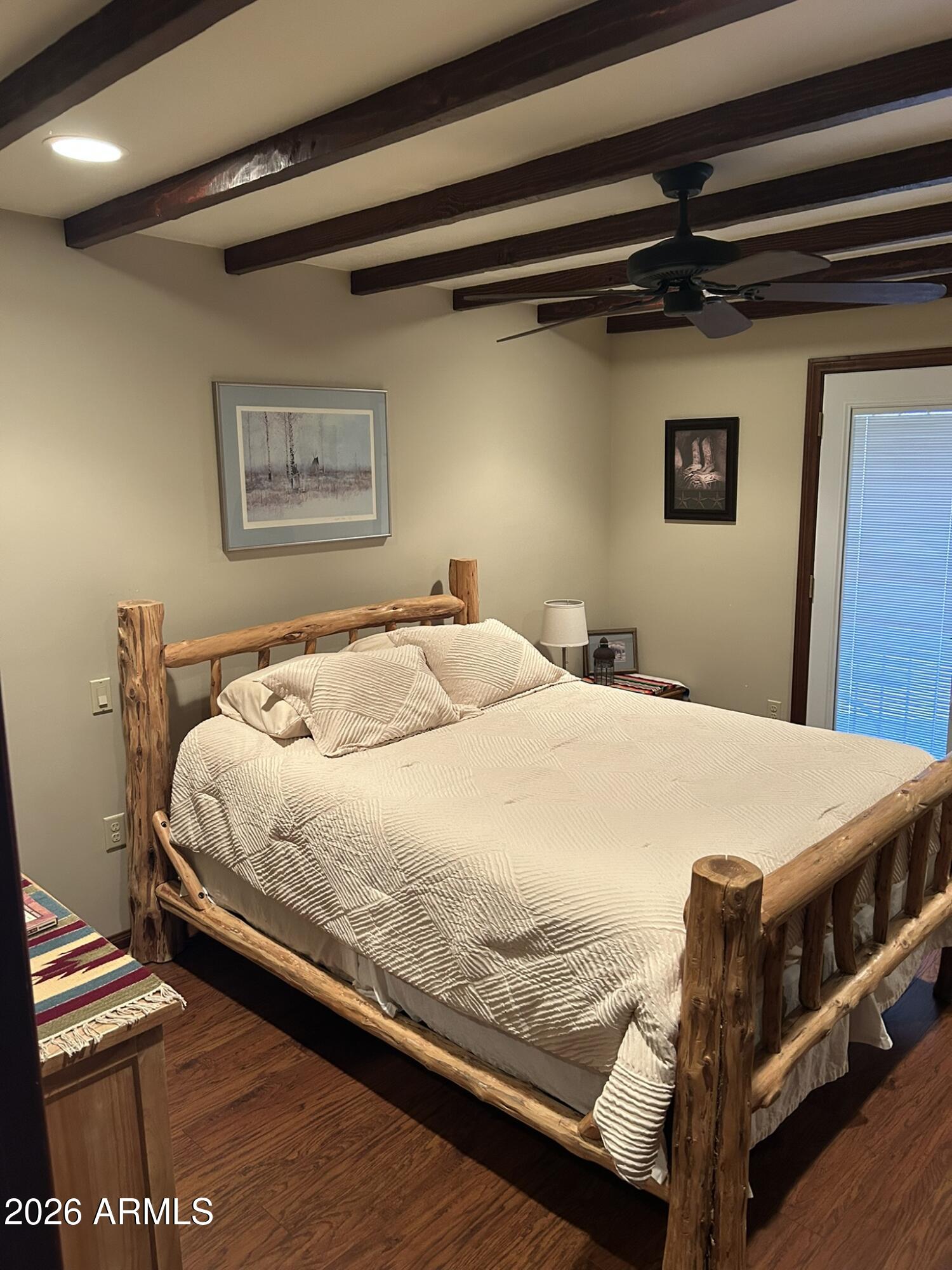 1172 West Mountain View Green Valley, AZ 85622 - Photo 22 of 35 a bed sitting in a bedroom next to a window