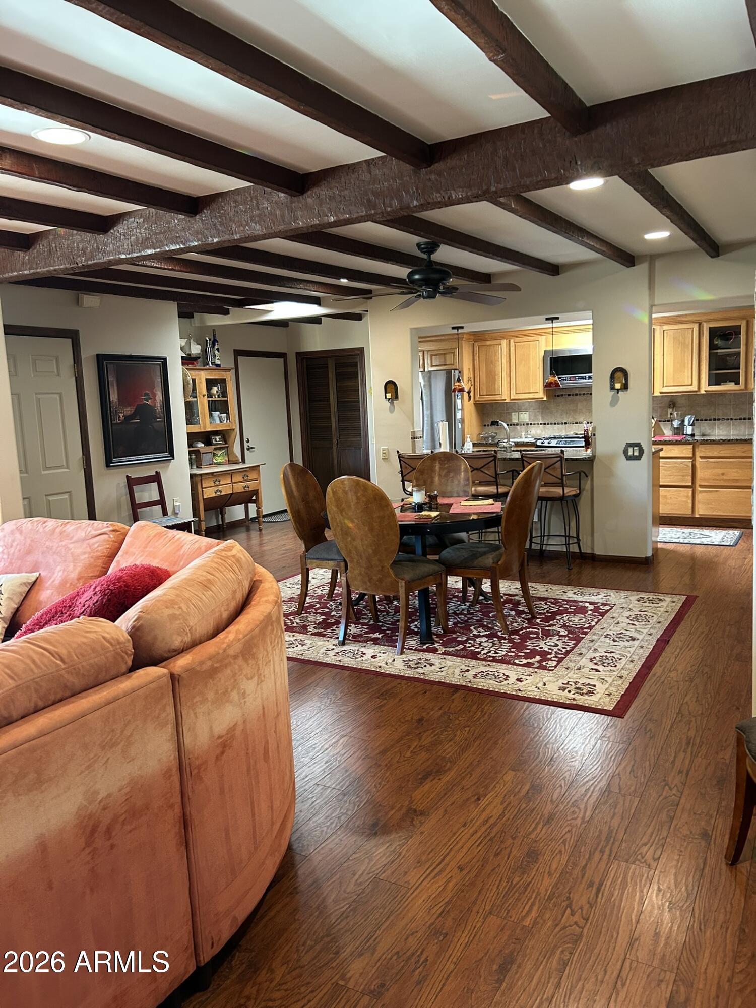 1172 West Mountain View Green Valley, AZ 85622 - Photo 32 of 35 a living room with furniture and a wooden floor