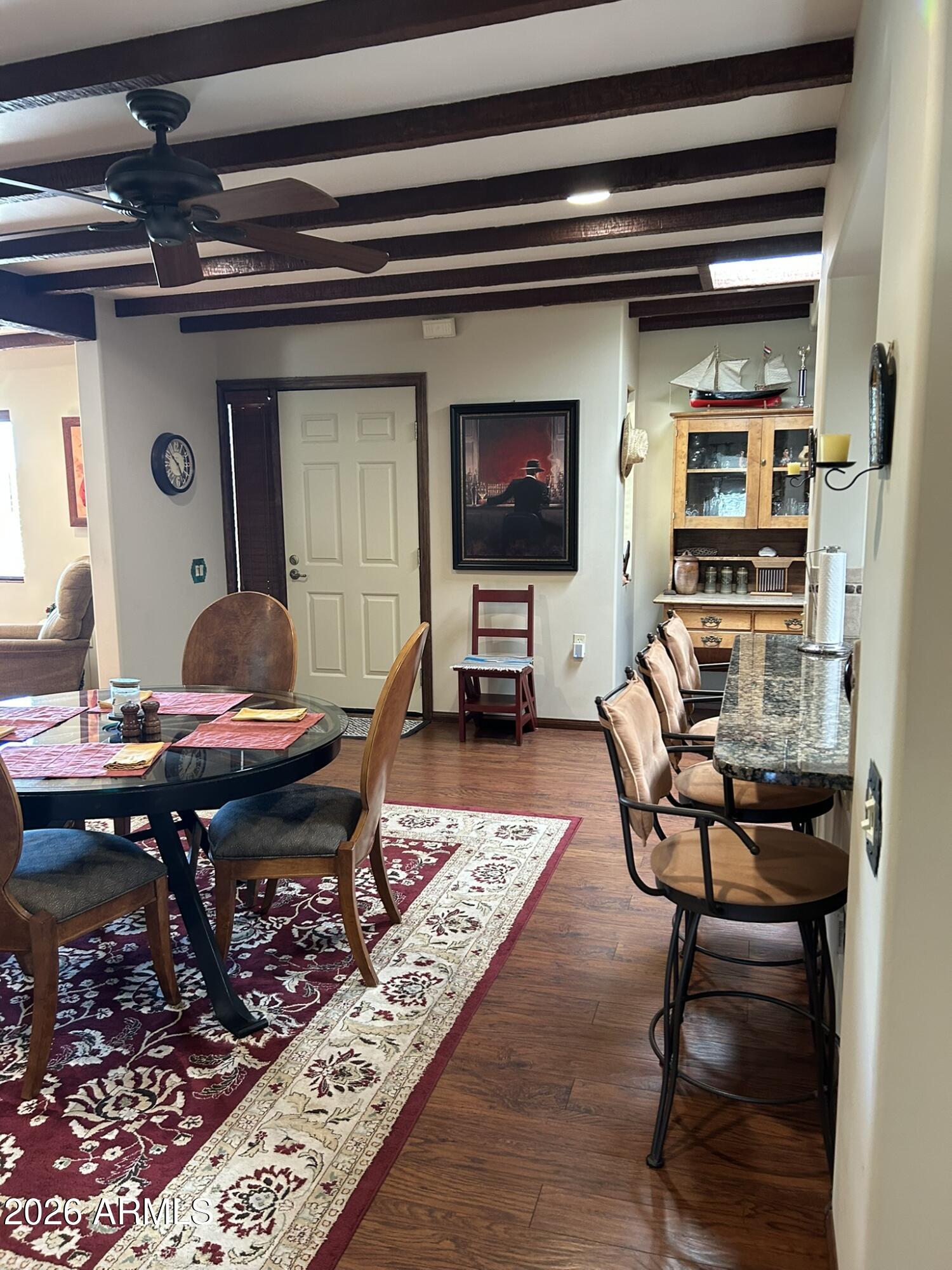 1172 West Mountain View Green Valley, AZ 85622 - Photo 33 of 35 a living room with furniture and a flat screen tv
