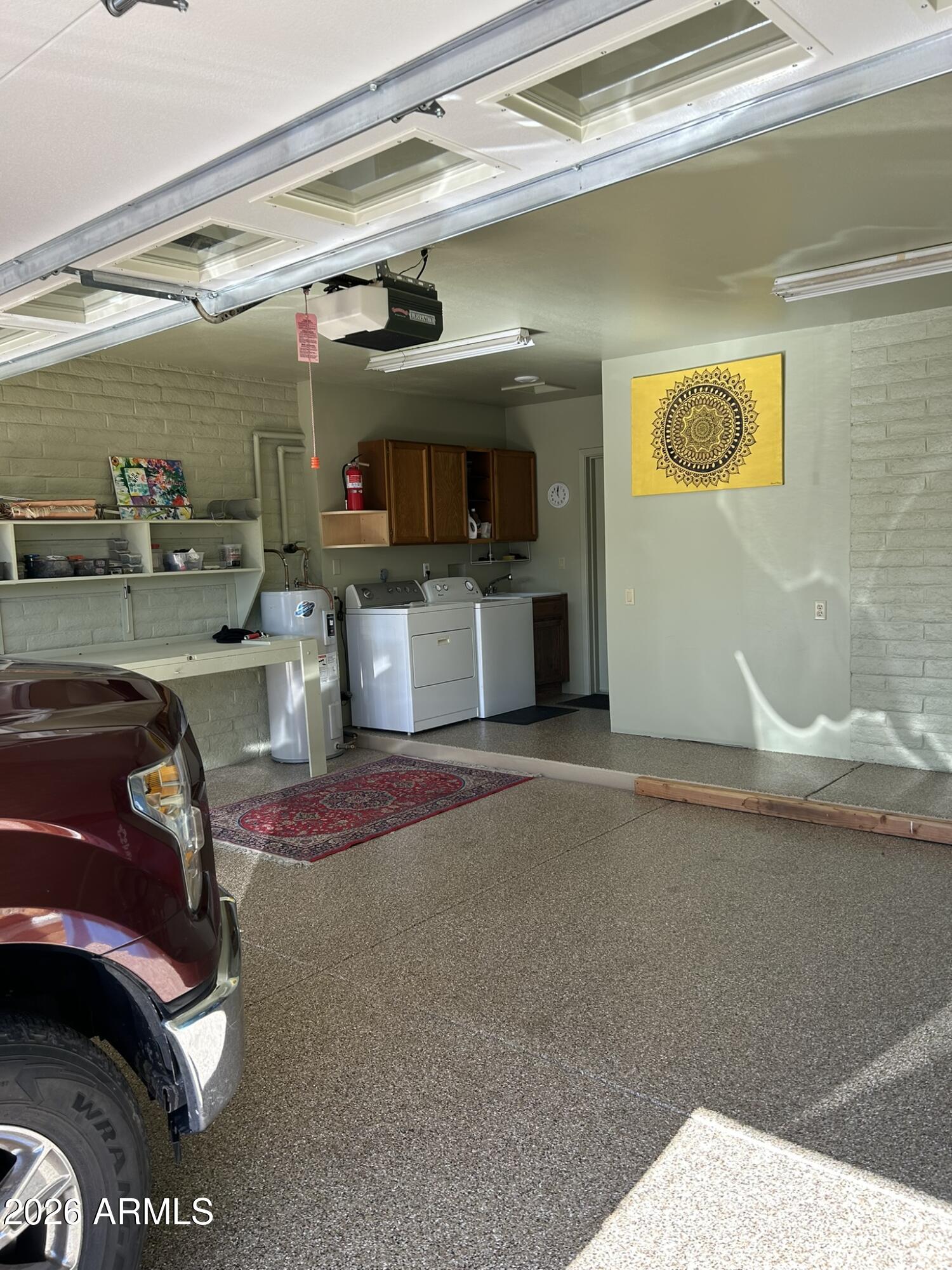 1172 West Mountain View Green Valley, AZ 85622 - Photo 34 of 35 a living room with furniture and a flat screen tv