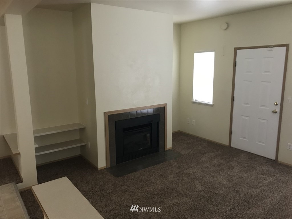 115 Union Avenue Northeast Renton, WA 98059 - Photo 7 of 20 a view of a livingroom with a fireplace