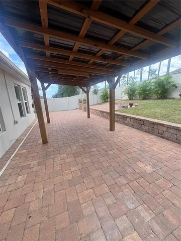 a view of a yard with large trees