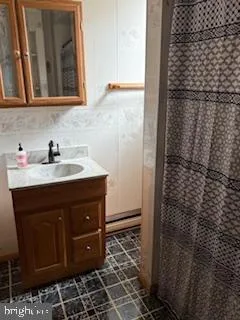 a bathroom with a sink and a mirror