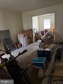 a room with wooden floor and furniture