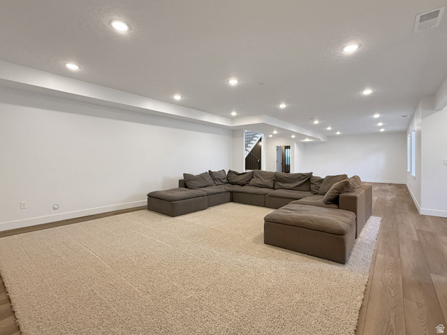 916 Rocky Mountain Way Elk Ridge, UT 84651 - Photo 42 of 54 Living area featuring light wood finished floors and recessed lighting