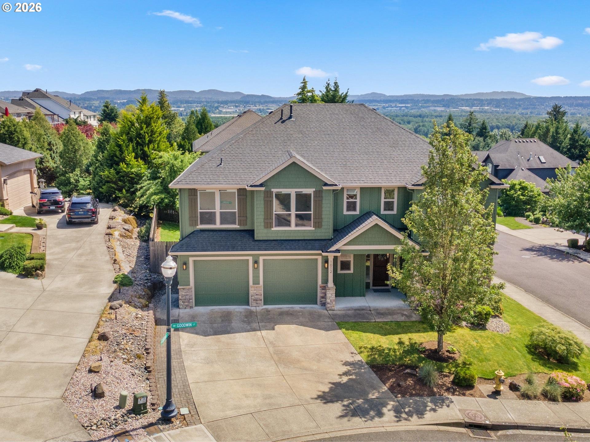 1012 Northwest Goodwin Street Camas, WA 98607 - Photo 37 of 44 a front view of a house with a yard and garage