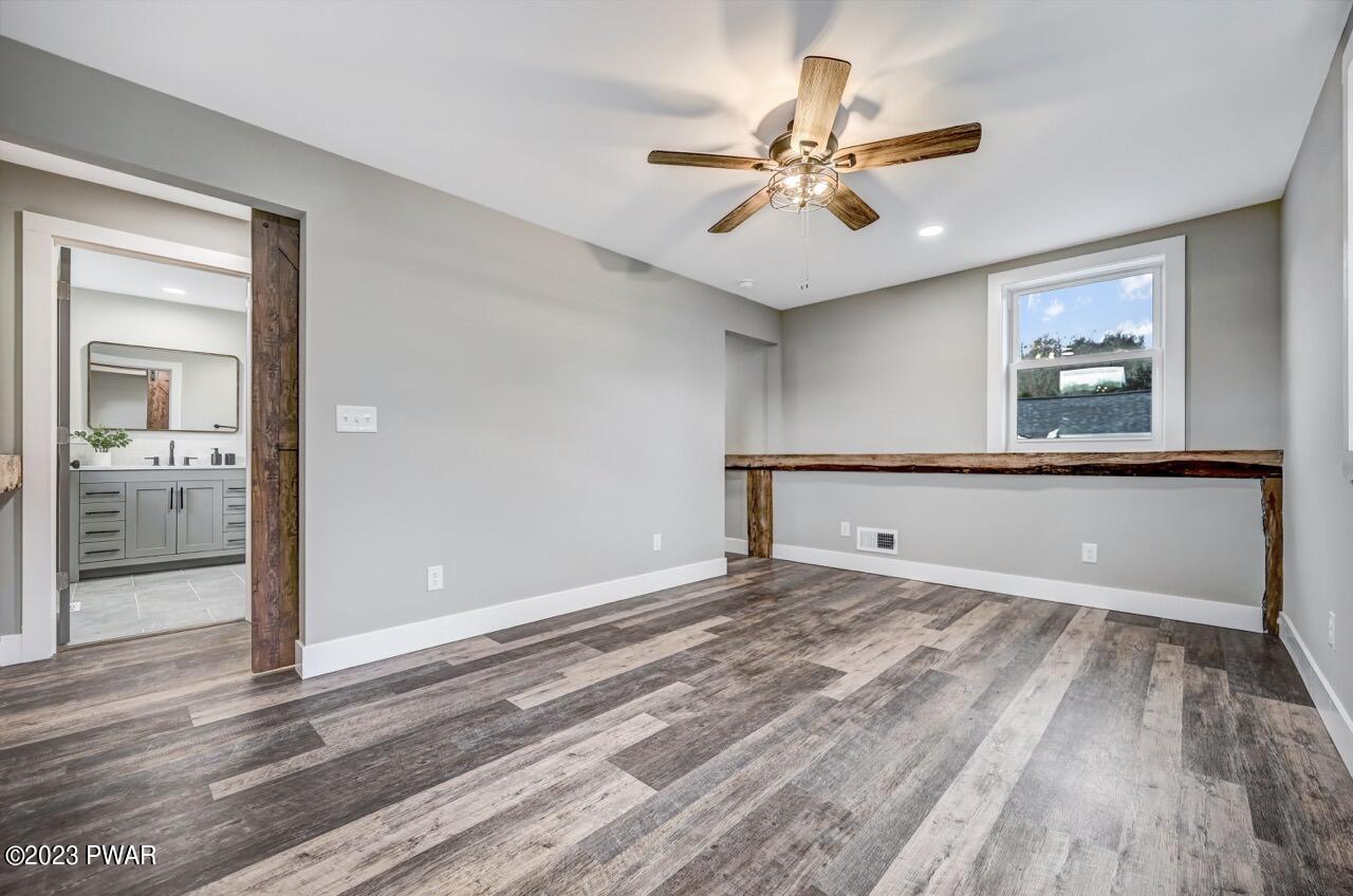 16 Pond Road Moscow, PA 18444 - Photo 32 of 55 wooden floor in an empty room with a window