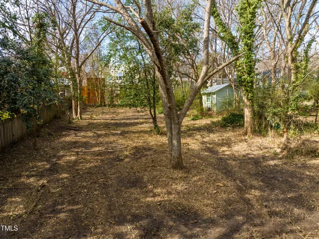 a backyard of a house with trees