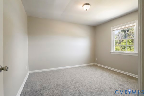 4605 Cogbill Road Richmond, VA 23234 - Photo 13 of 20 Carpeted room featuring a white-trimmed window, ne