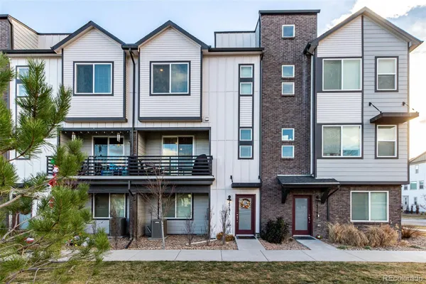 a front view of a building with retail shops