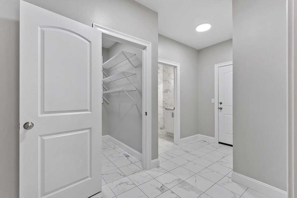186 Justice Hill Road, Unit OAKMONT Sterling, MA 01564 - Photo 11 of 34 a view of a bathroom with shower