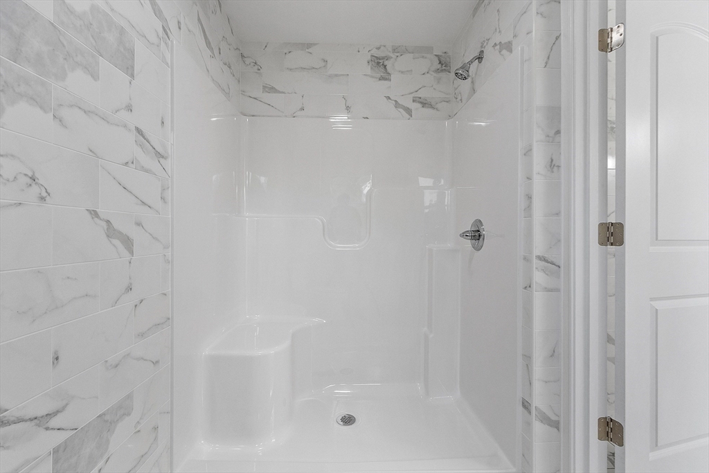 186 Justice Hill Road, Unit OAKMONT Sterling, MA 01564 - Photo 23 of 34 a bathroom with a shower