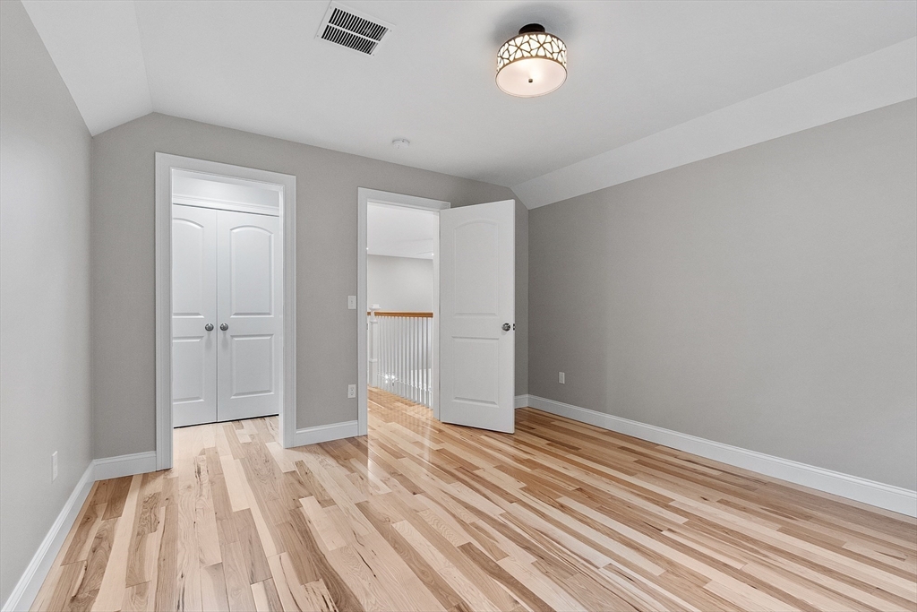 186 Justice Hill Road, Unit OAKMONT Sterling, MA 01564 - Photo 31 of 34 a view of wooden floor and windows in a room