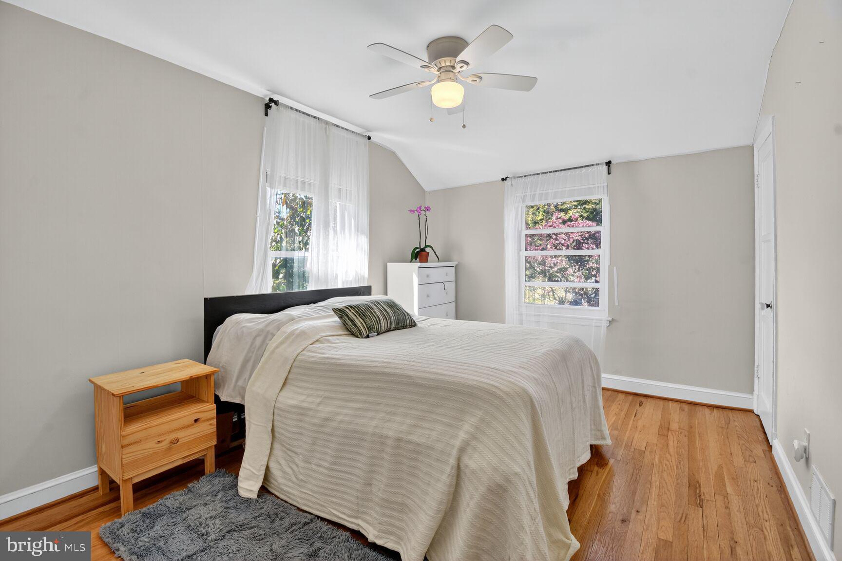 10021 Tenbrook Drive Silver Spring, MD 20901 - Photo 11 of 21 a bedroom with a bed dresser and a window