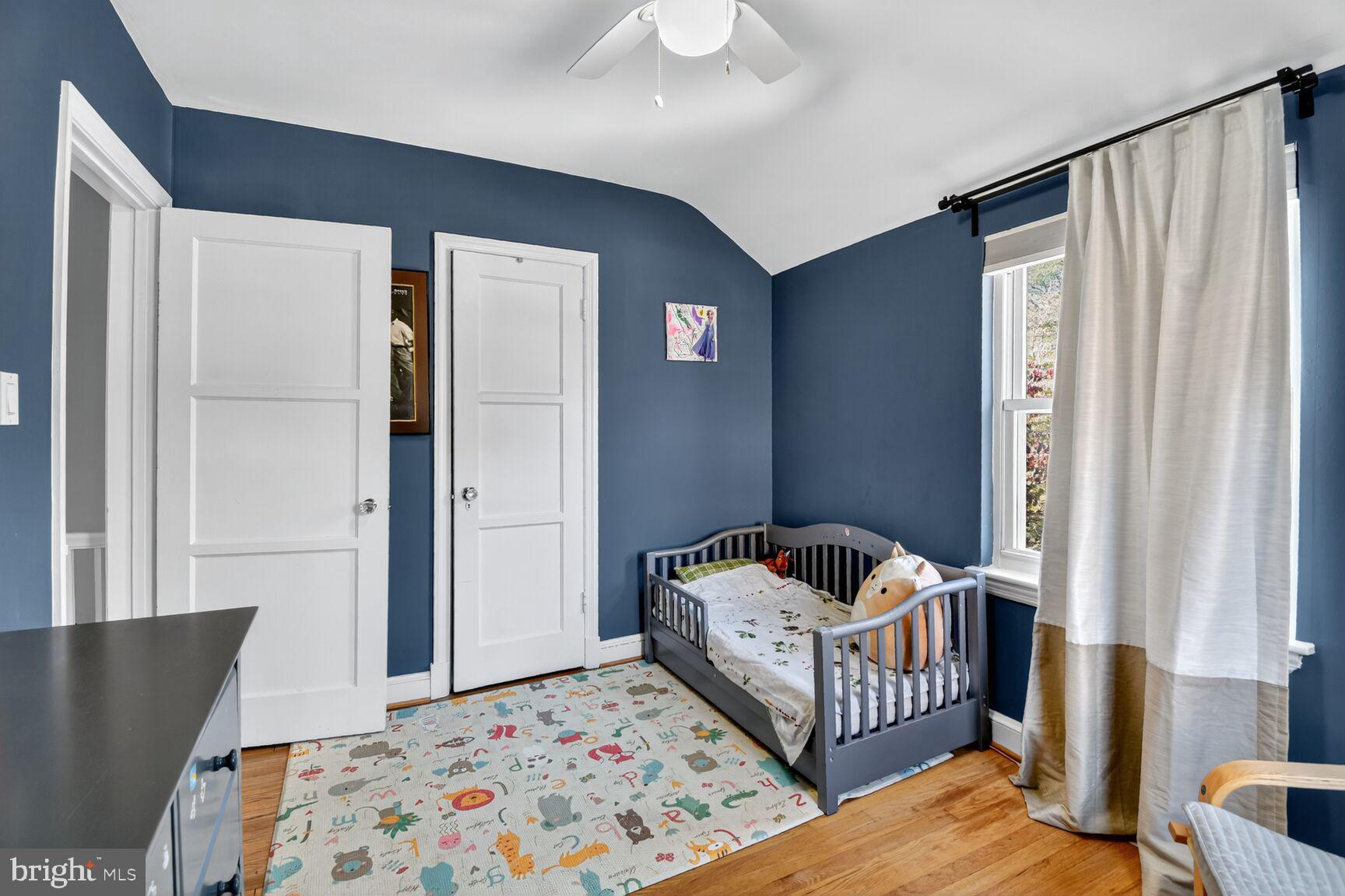 10021 Tenbrook Drive Silver Spring, MD 20901 - Photo 14 of 21 a bedroom with furniture and baby crib