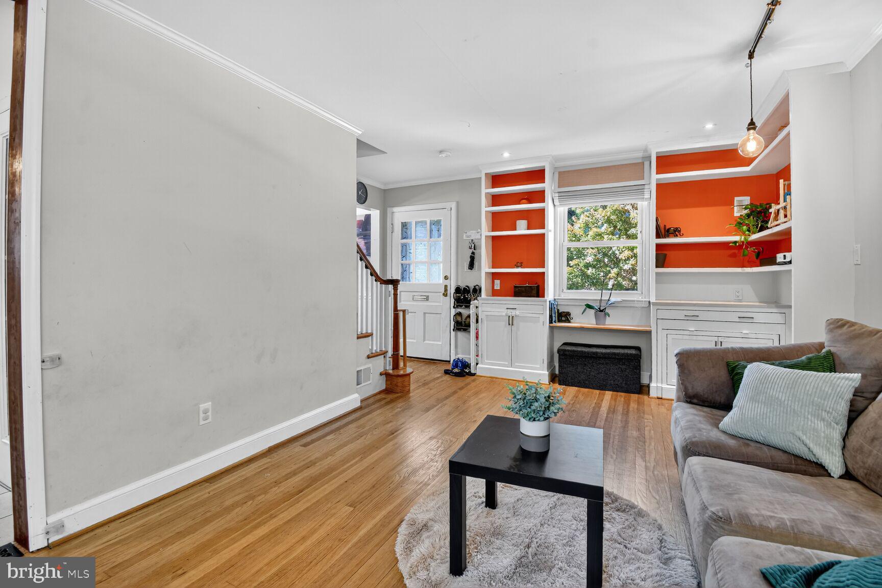 10021 Tenbrook Drive Silver Spring, MD 20901 - Photo 4 of 21 a living room with furniture and a fireplace