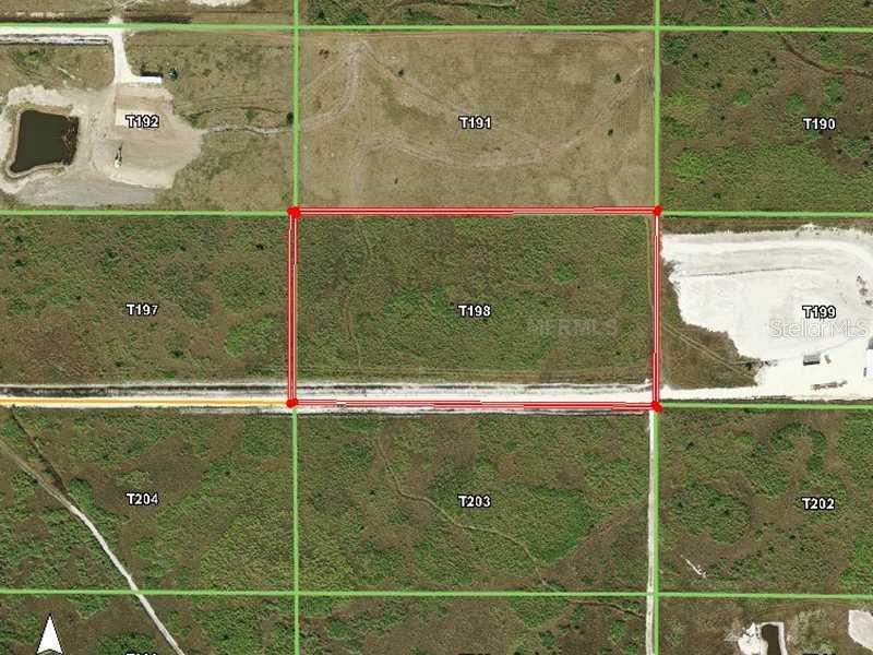 48693 Bermont Road Punta Gorda, FL 33982 - Photo 1 of 1 Aerial View - Road access is from left off of Marl main road. There is road frontage on the south and east sides of property