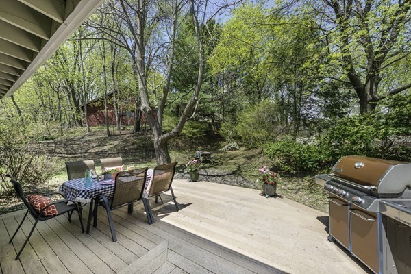 23 Mason Street Lexington, MA 02421 - Photo 23 of 24 a backyard of a house with table and chairs