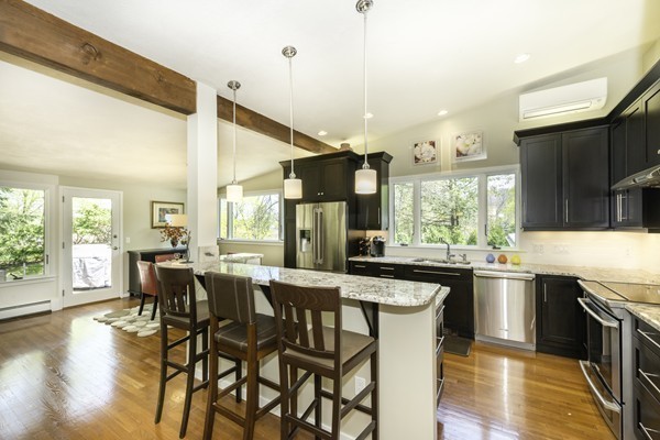 23 Mason Street Lexington, MA 02421 - Photo 4 of 24 a large kitchen with a table and chairs
