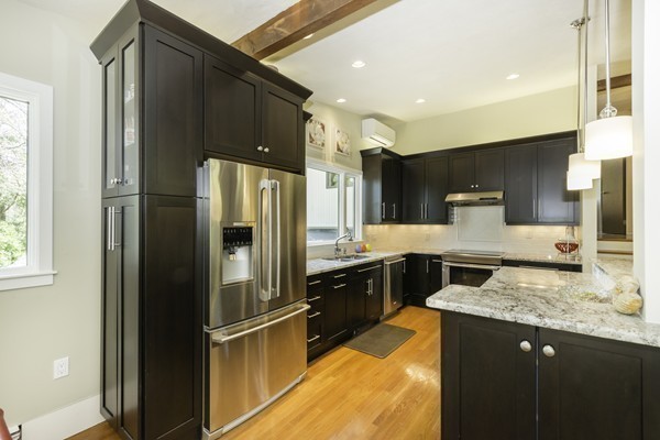 23 Mason Street Lexington, MA 02421 - Photo 5 of 24 a kitchen with a refrigerator and a sink
