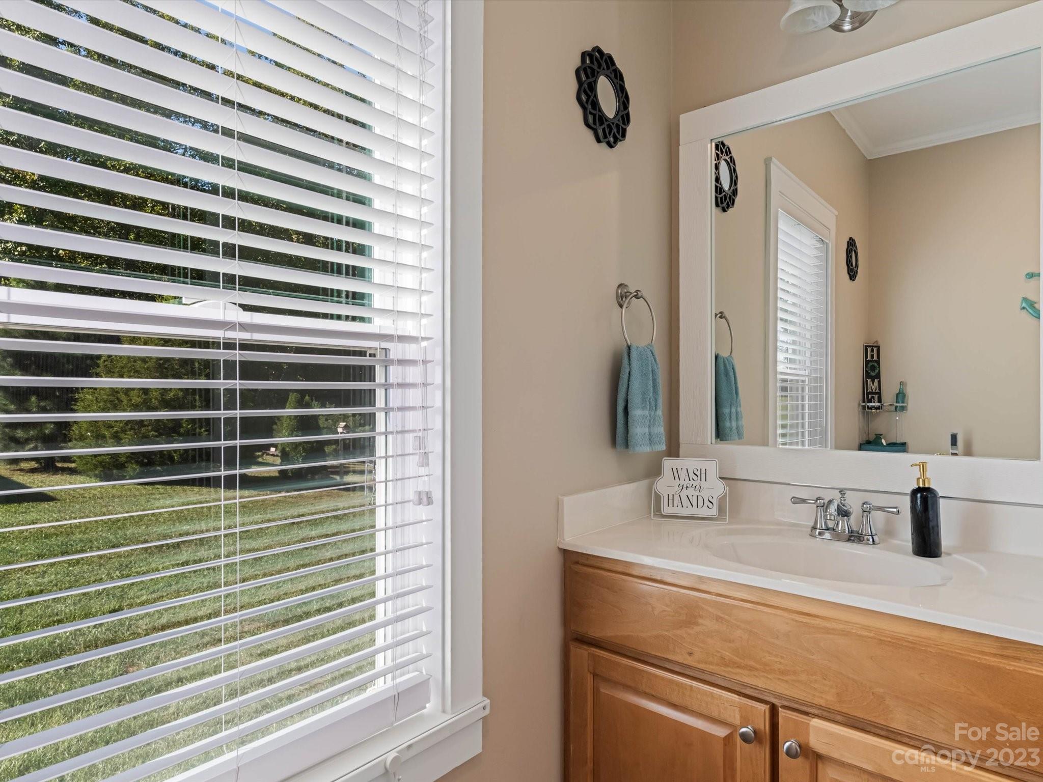 125 Boulder Ridge Drive State Road, NC 28676 - Photo 18 of 39 a bathroom with a sink and a mirror