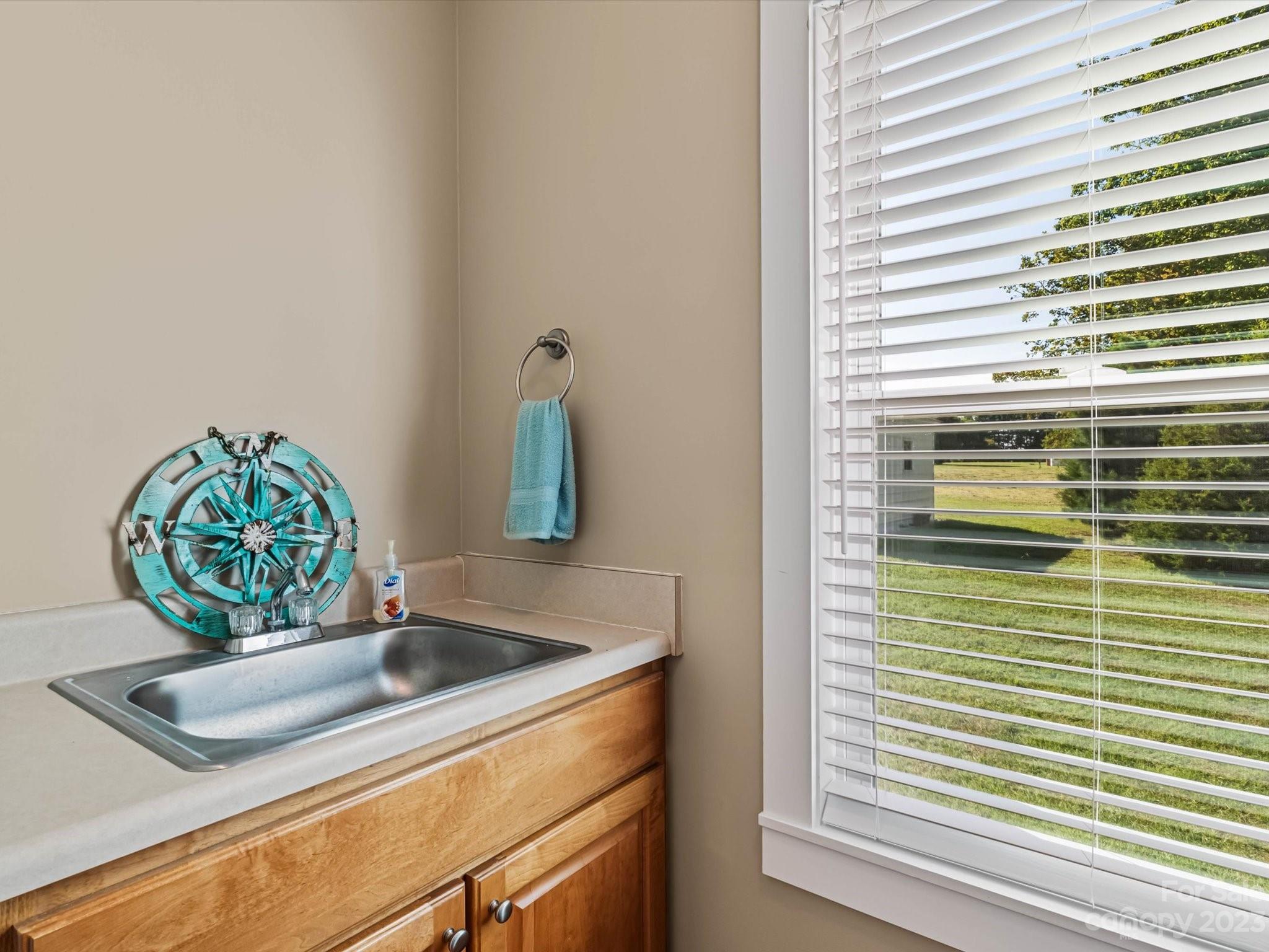 125 Boulder Ridge Drive State Road, NC 28676 - Photo 20 of 39 a bathroom with a sink and a window