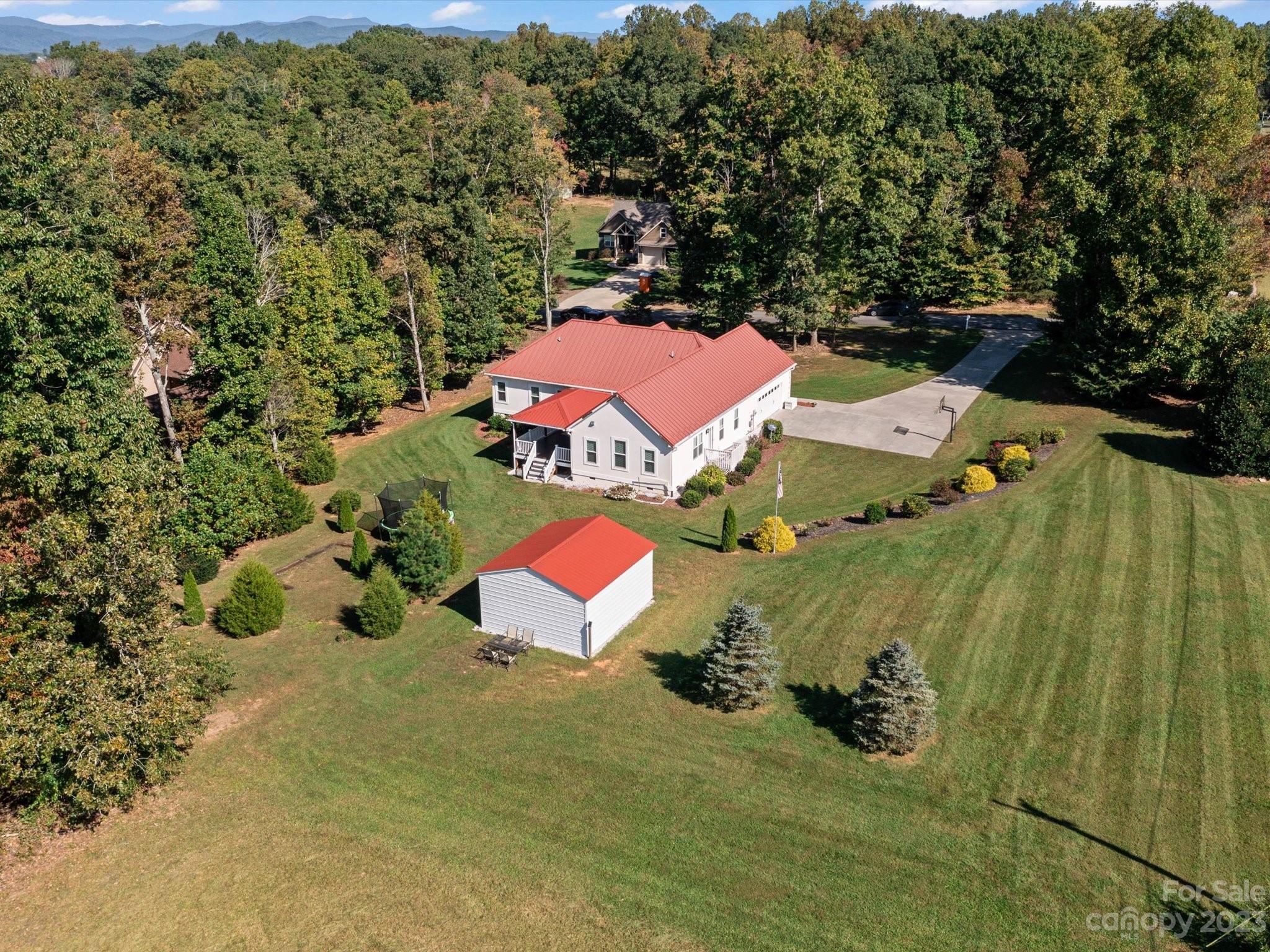 125 Boulder Ridge Drive State Road, NC 28676 - Photo 32 of 39 an aerial view of a house with a yard