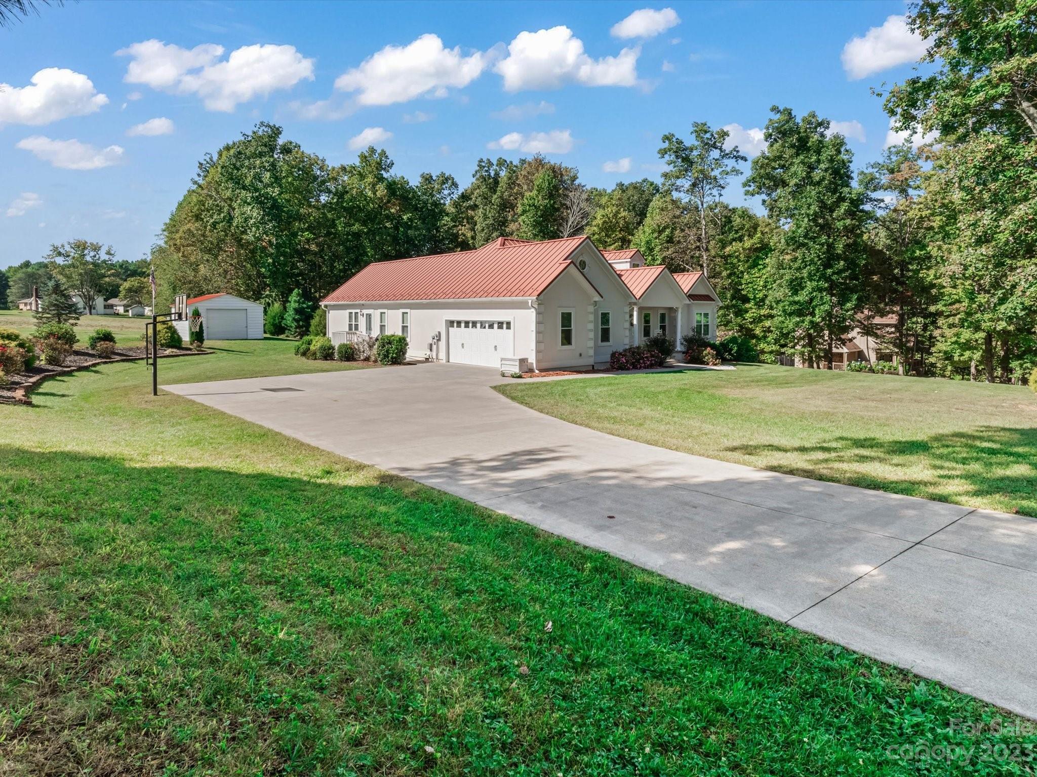 125 Boulder Ridge Drive State Road, NC 28676 - Photo 38 of 39 a front view of a house with yard and green space