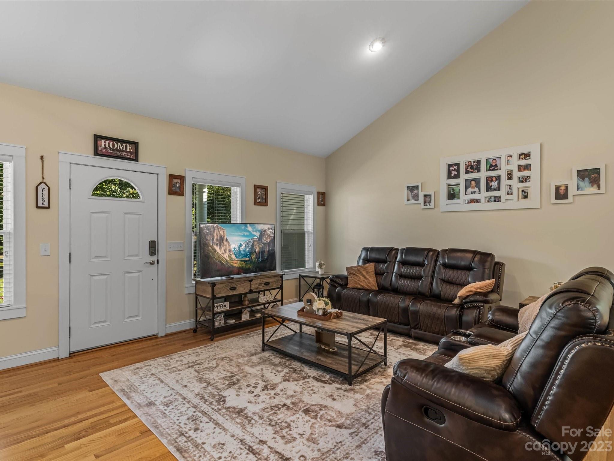 125 Boulder Ridge Drive State Road, NC 28676 - Photo 4 of 39 a living room with furniture and a flat screen tv