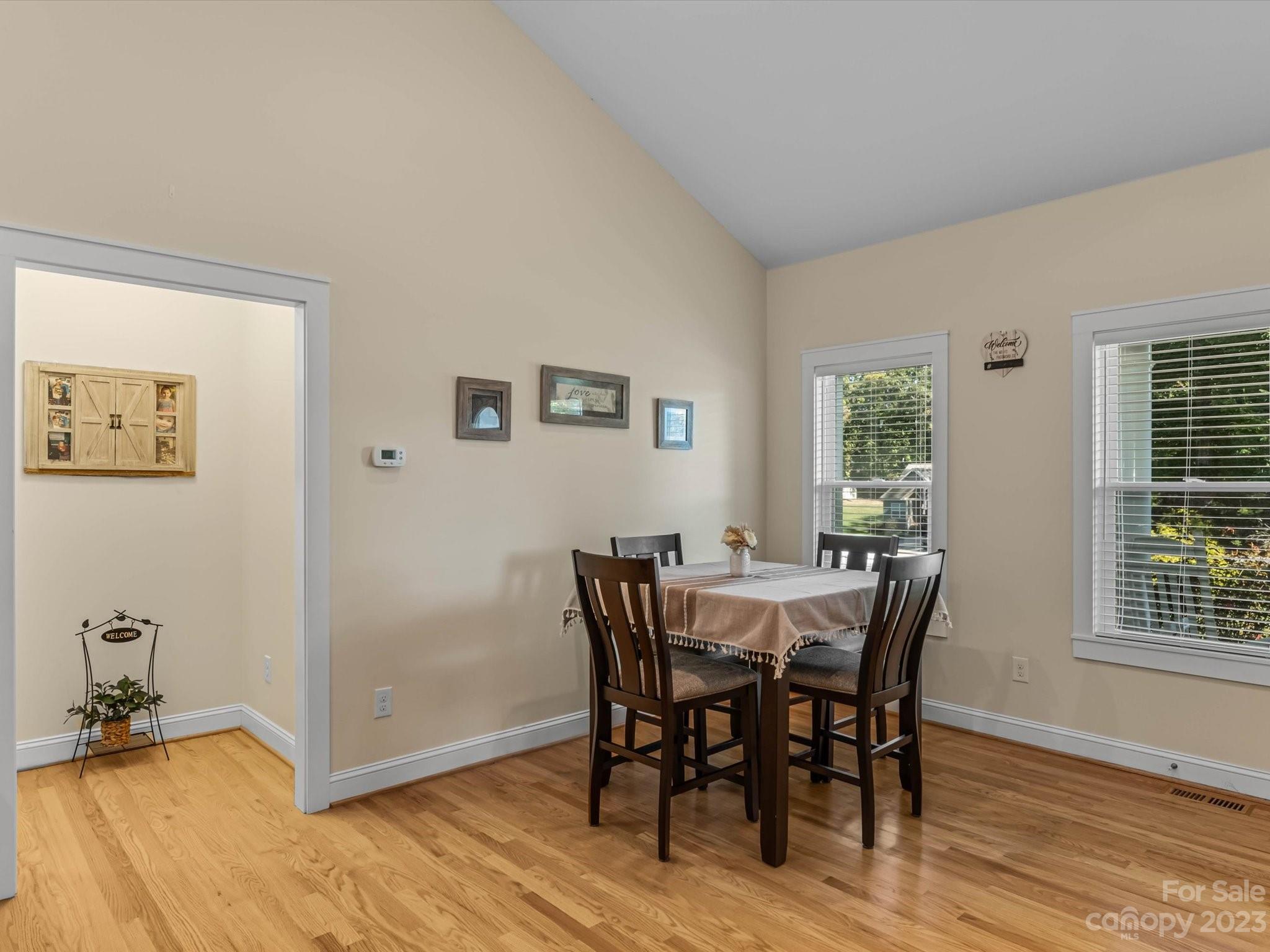 125 Boulder Ridge Drive State Road, NC 28676 - Photo 5 of 39 a view of a dining room with furniture and wooden floor
