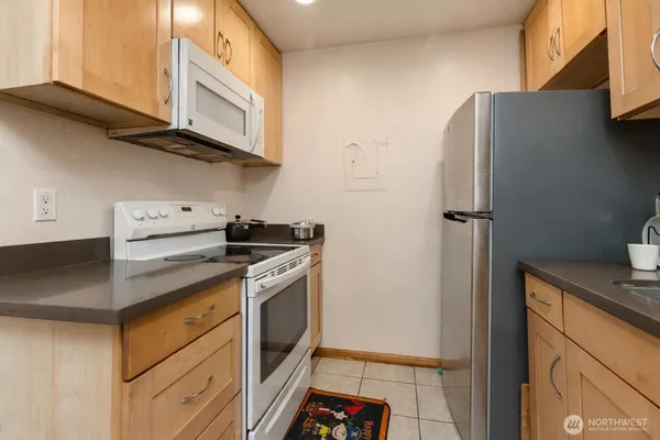 a kitchen with a table and chairs in it