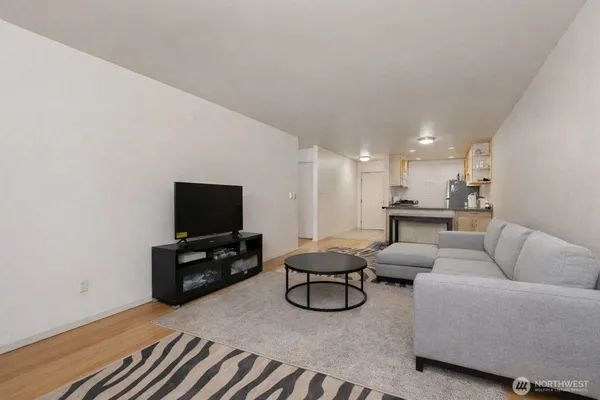 a bathroom with a granite countertop sink a toilet and a mirror