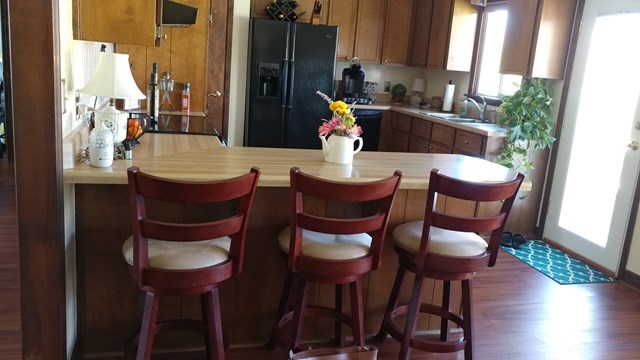 4611 Jones Road Macon, GA 31216 - Photo 8 of 13 a view of a dining room with furniture and wooden floor