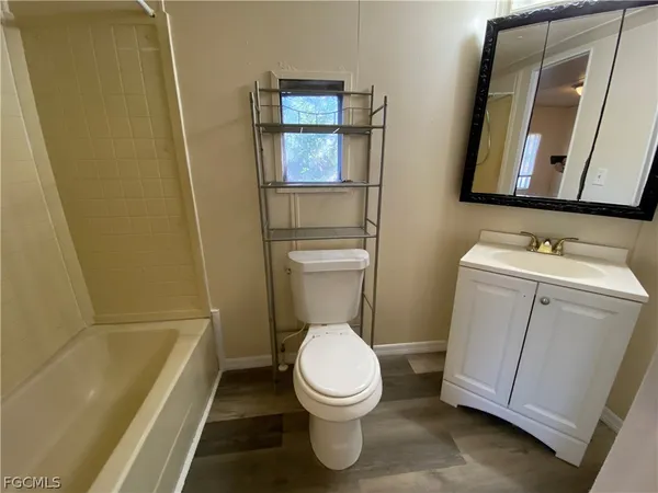 a bathroom with a toilet a sink and a bathtub