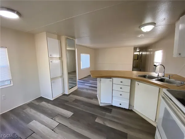 a kitchen with a sink and cabinets