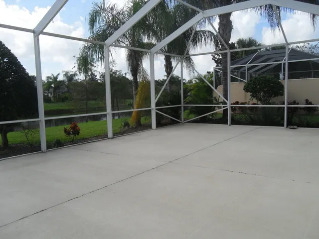a backyard of a house with portable swimming pool and basket ball court